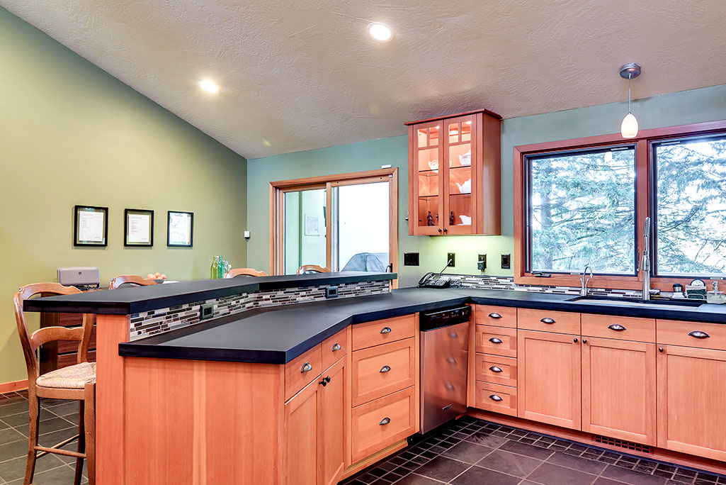 Paper stone countertops & tiled slate floors