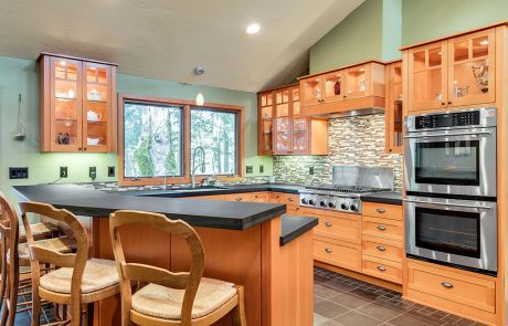 Glass upper cabinets with lighting in Eugene