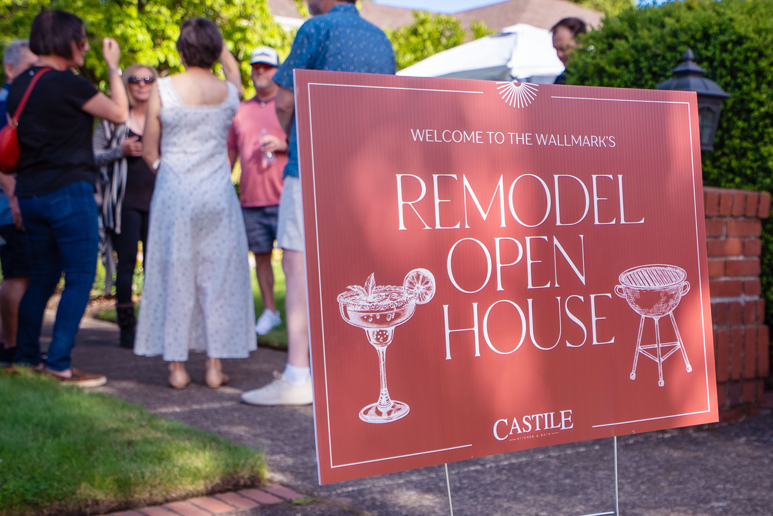 Remodel open house sign with guests Remodel open house sign with guests